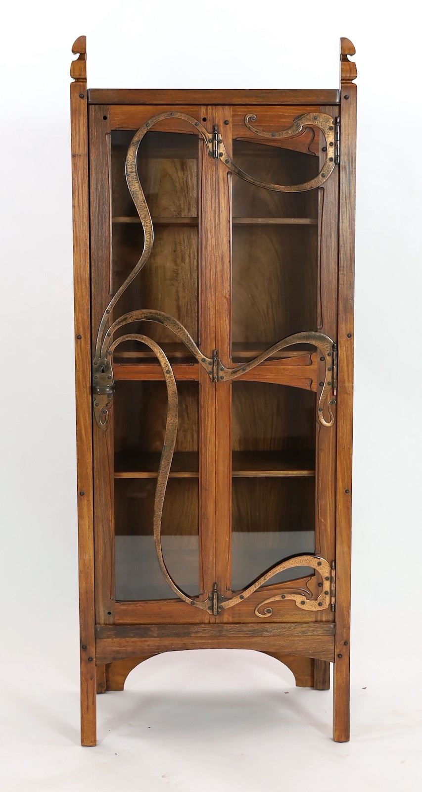 Gustave Serrurier-Bovy (Belgian 1858–1910). An Art Nouveau copper mounted red narra wood vitrine, width 68cm, depth 40cm, height 174cm